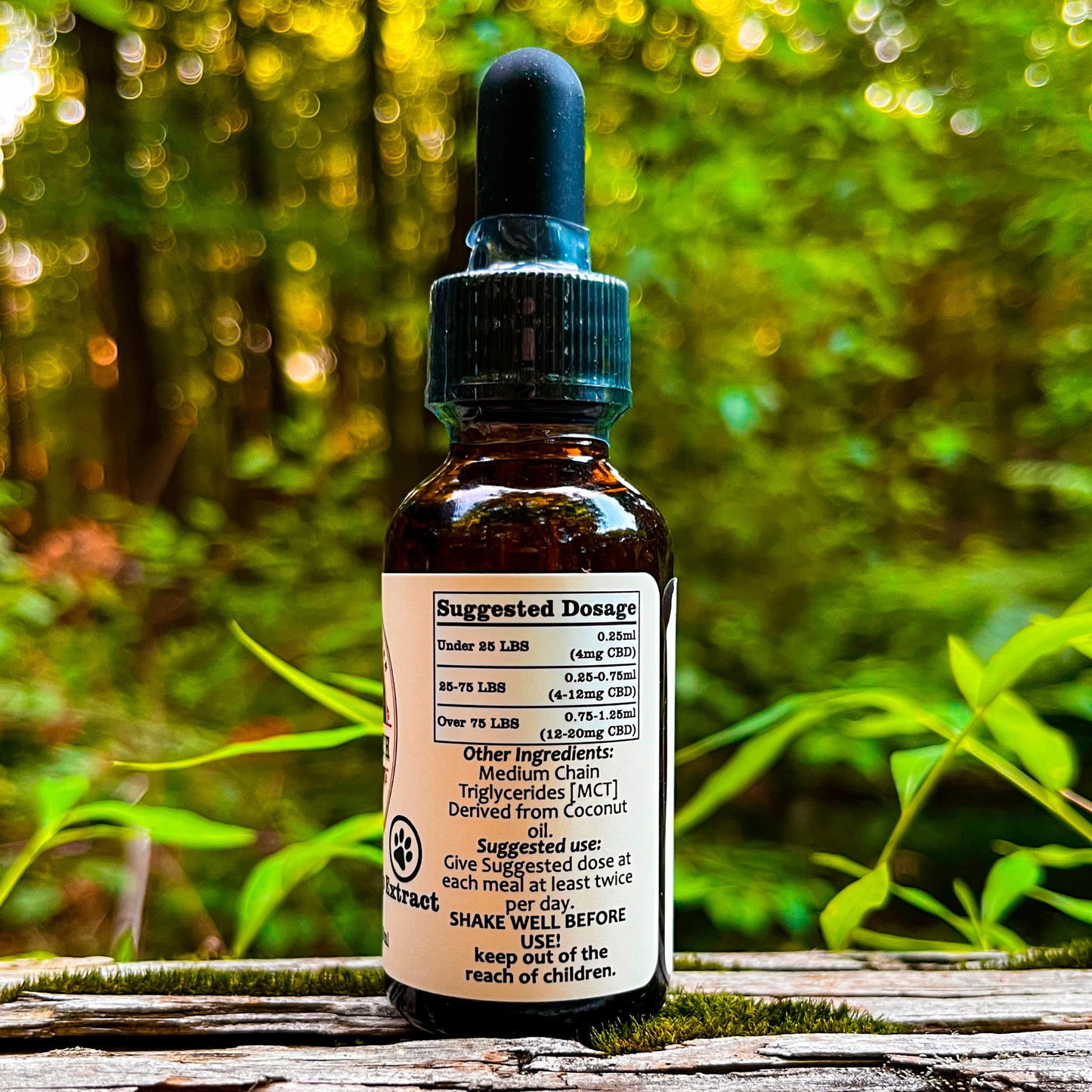 An image of a small bottle labeled Dark Earth Farms Full Spectrum Hemp Extract for Pets, featuring a green and yellow label with the brand name and product information. The bottle contains 500mg of CBD oil with terpenes and cannabinoids, specifically designed for pets to help alleviate pain, anxiety, and improve sleep. The bottle is placed on a wooden surface, surrounded by hemp leaves and a small dropper next to it, ready for use.
