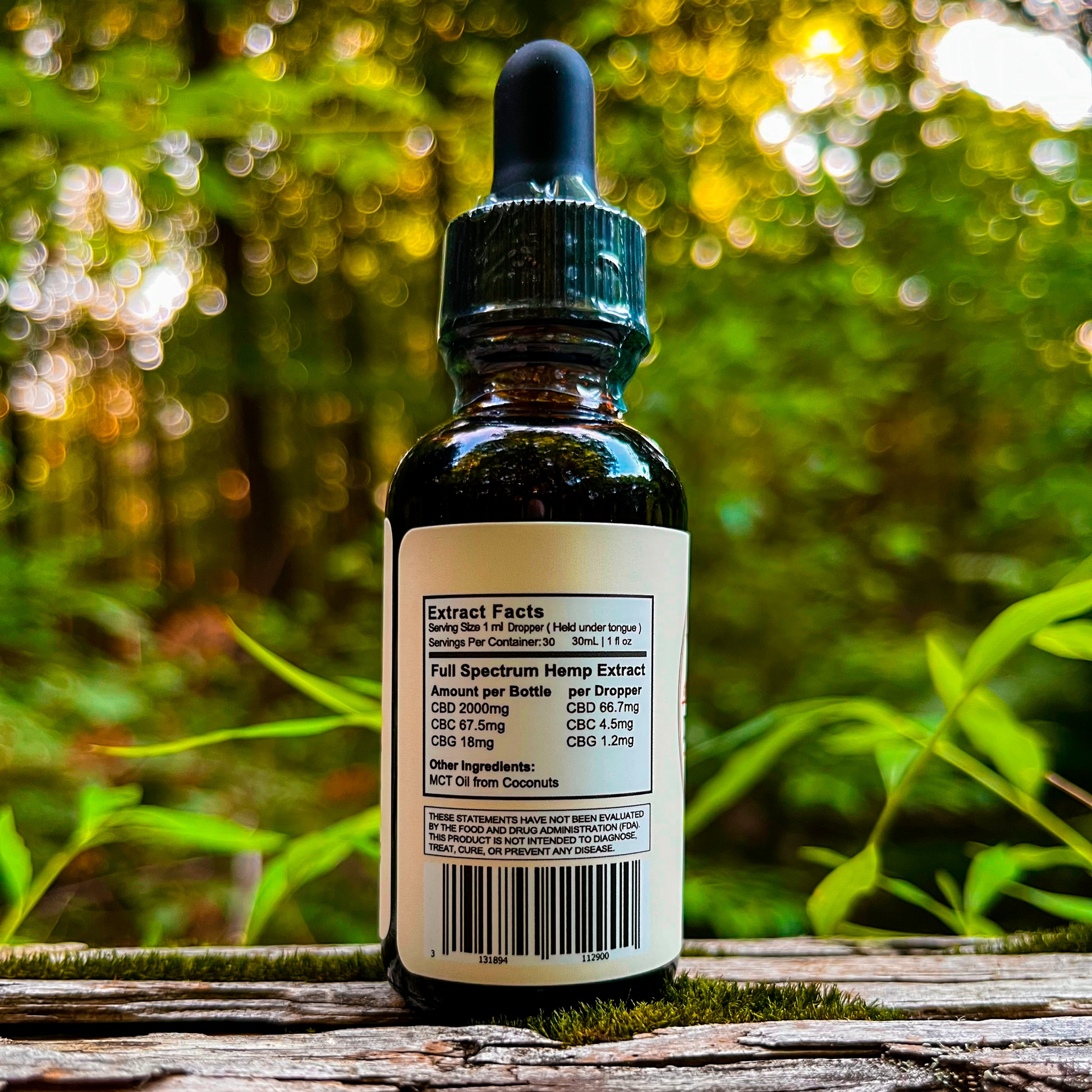An image of a small bottle labeled Dark Earth Farms Full Spectrum Hemp Extract, featuring a green and yellow label with the brand name and product information. The bottle contains 2000mg of CBD oil with terpenes and cannabinoids, specifically designed to help alleviate pain, anxiety, and improve sleep. The bottle is placed on a wooden surface, surrounded by leaves and a small dropper next to it, ready for use.